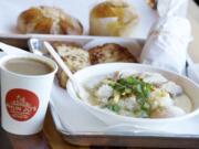 Milk toast, rice soup with chicken, a taro bun, background left, and a pineapple bun are served Dec.