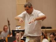 Steve Dipaola/for the Columbian 
 Power in the woodwind section: Clarinetist Steve Bass, left, is the president of Oregon Public Broadcasting, and lead clarinetist Igor Shakhman is manager and executive director of the Vancouver Symphony Orchestra .