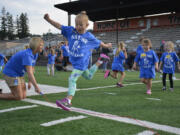 Washougal: Khloe Handley jumps over a rope at Gause Elementary School&#039;s 15th annual Sport-A-Thon on Sept.