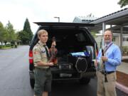 Mill Plain: Eagle Scout Clayton Wahlstrom, left, of Troop 462 presents the 35 instruments he collected to Don Nelson, manager of Evergreen Public Schools' fine and performing arts program.