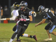 Hockinson's Matt Henry  runs against Hudson's Bay's Carter Morse Friday at Hockinson.