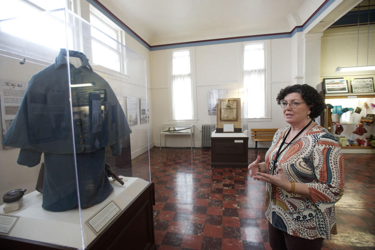 Kris Wells, museum collections manager, describes Civil War exhibits, including Albert Marion Edmonds' Union cavalry coat. Top: Lewis Sutton writes about Gen.