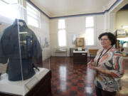 Kris Wells, museum collections manager, describes Civil War exhibits, including Albert Marion Edmonds' Union cavalry coat. Top: Lewis Sutton writes about Gen.