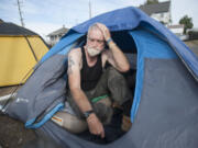 Stephen David Blair Richardson, 66, who says he&#039;s a former CIA agent, sits in his tent near Share House in west Vancouver.