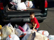 Jayden Le helps gather donations for Open House Ministries. His dad, David Le, wants to support Open House and other homeless shelters this weekend with a donation drive.