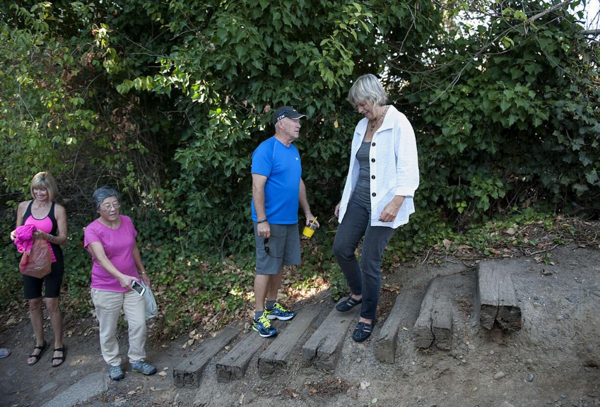 Vancouver residents Gail Welsh, from left, Carol Brunner, Steve Stipe and Deb Fischer are concerned about the condition of the stairs at the east entrance to Wintler Park near the Columbia River.