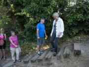 Vancouver residents Gail Welsh, from left, Carol Brunner, Steve Stipe and Deb Fischer are concerned about the condition of the stairs at the east entrance to Wintler Park near the Columbia River.