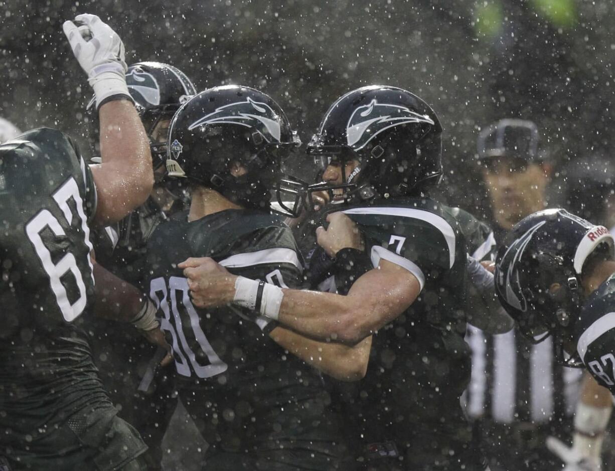 Portland State quarterback Alex Kuresa (right) celebrates touchdown with Trent Riley (left) vs. Montana.