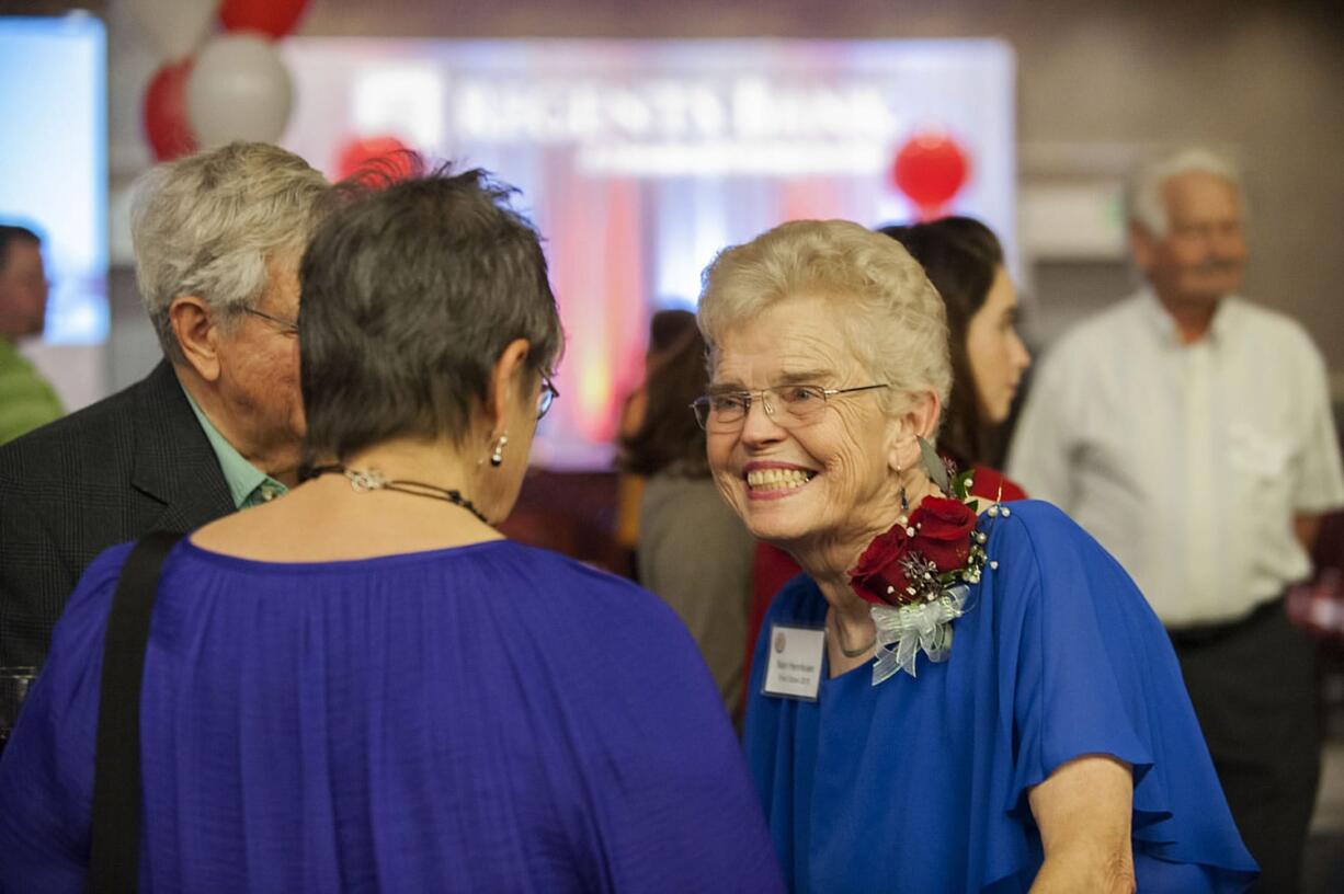 Former Camas mayor and Board of Freeholders chair Nan Henriksen greets a friend with her trademark grin before before being honored as First Citizen on Tuesday at the Hilton Vancouver Washington.