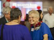 Former Camas mayor and Board of Freeholders chair Nan Henriksen greets a friend with her trademark grin before before being honored as First Citizen on Tuesday at the Hilton Vancouver Washington.