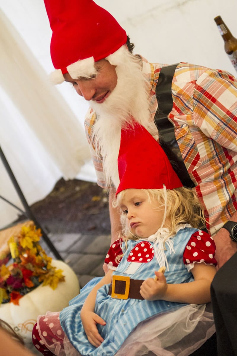 Tiny gnome Lily Sanders, sitting on her dad Ben&#039;s lap, tries to stay awake after taking part in all of the fun activities at Latte Da&#039;s Halloween costume party Saturday.