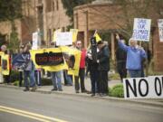 Protesters opposing an oil terminal at the Port of Vancouver gather Wednesday outside the Clark County Public Service Center before a meeting there of the state's Energy Facility Site Evaluation Council.