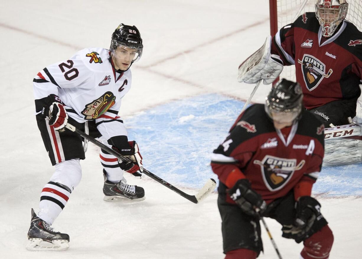 Portland Winterhawks captain Taylor Leier (20), setting up in front of the Vancouver net in game 1 of their first round playoff series, believes that his team's playoff experience will carry the Winterhawks into their next series against the Victoria Royals.