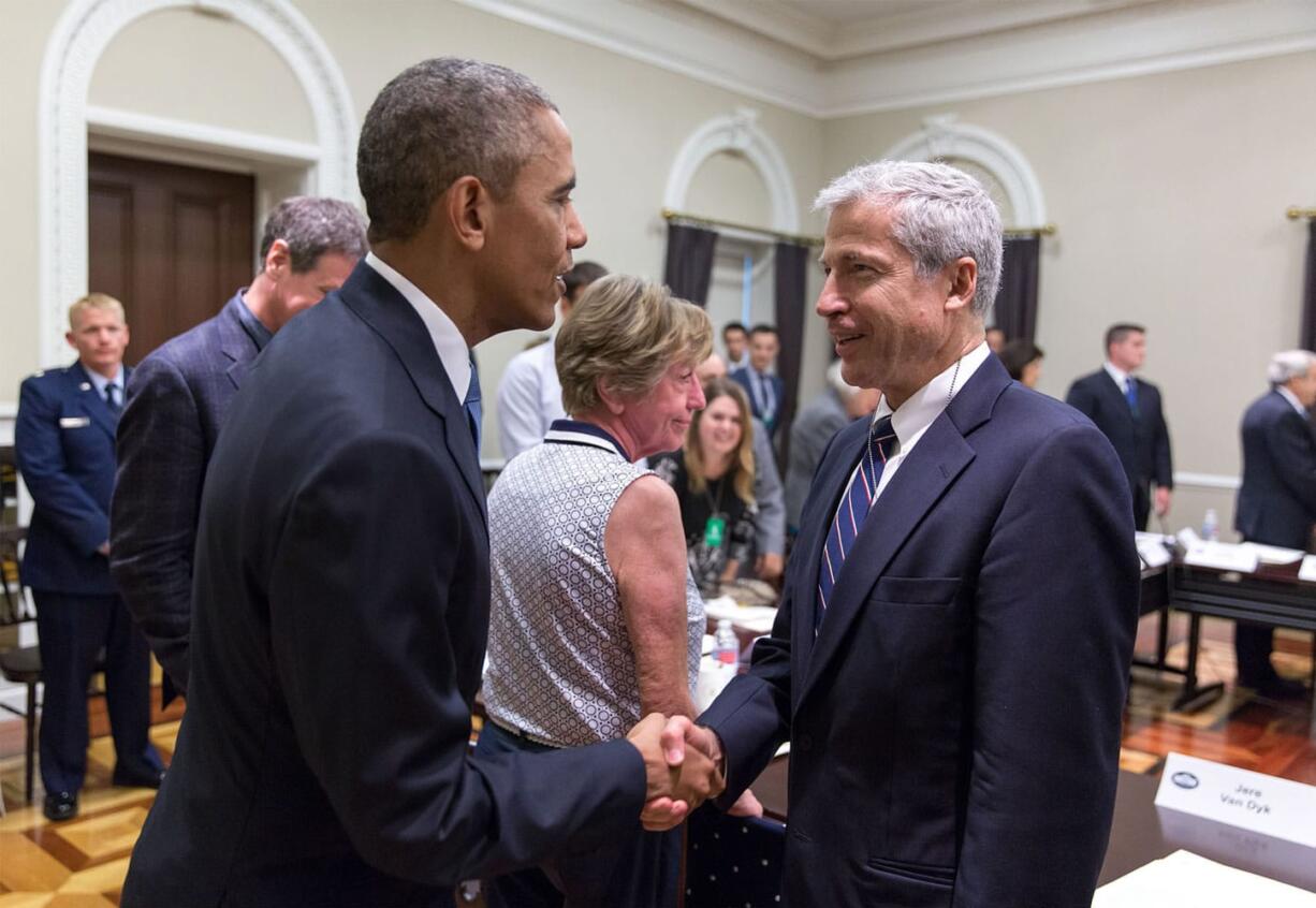 President Barack Obama greets Jere Van Dyk in June at a White House conference on hostage policy.