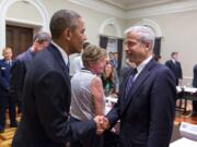 President Barack Obama greets Jere Van Dyk in June at a White House conference on hostage policy.