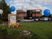 Blue and white balloons welcome visitors at the new Columbia River Mental Health Services offices during a Thursday open house at the new clinic in Hazel Dell.