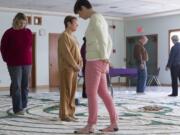 Participants walk through a canvas labyrinth at First Presbyterian Church in Vancouver on New Year's Day.