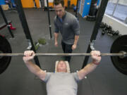 David Williams, 61, of Hockinson lifts weights under the guidance of Brian Stecker, a personal trainer who specializes in fitness for baby boomers, at his east Vancouver training studio.