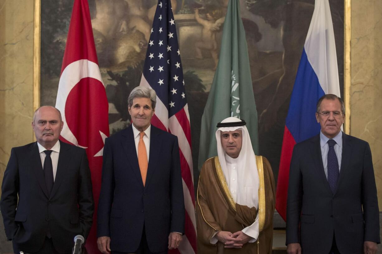From left, Turkey&#039;s Minister of Foreign Affairs, Feridun Sinirlioglu, U.S. Secretary of State John Kerry,  Saudi Arabia&#039;s  Minister of Foreign Affairs Arabia Adel al-Jubeir and Russia&#039;s Foreign Minister Sergey Lavrov pose for a photo Friday during a meeting in Vienna. Kerry and his Russian, Saudi and Turkish counterparts met in Vienna on Friday, seeking to revive a moribund effort to end Syria&#039;s civil war.