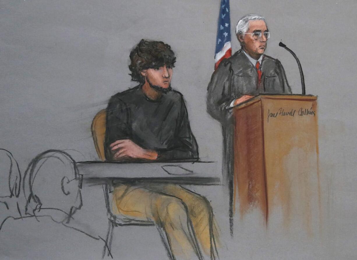 In this Jan. 5 courtroom sketch, Boston Marathon bombing suspect Dzhokhar Tsarnaev, left, is depicted beside U.S.