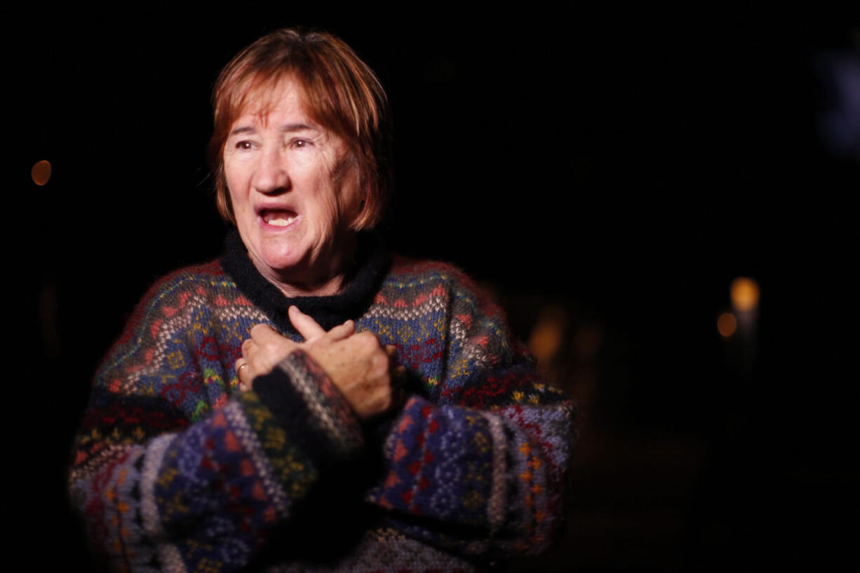 Local resident Sheila Simpson talks to reporters about how she helped passengers aboard a whale-watching boat who were rescued as they were brought to the First Street dock after their tour boat capsized near Tofino, B.C., early Monday.