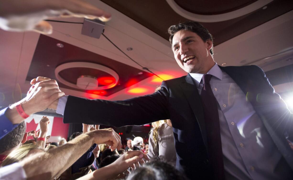 Liberal leader Justin Trudeau greets supporters at the Liberal party headquarters in Montreal, Tuesday. Trudeau, the son of late Prime Minister Pierre Trudeau, became Canadas new prime minister after beating Conservative Stephen Harper.