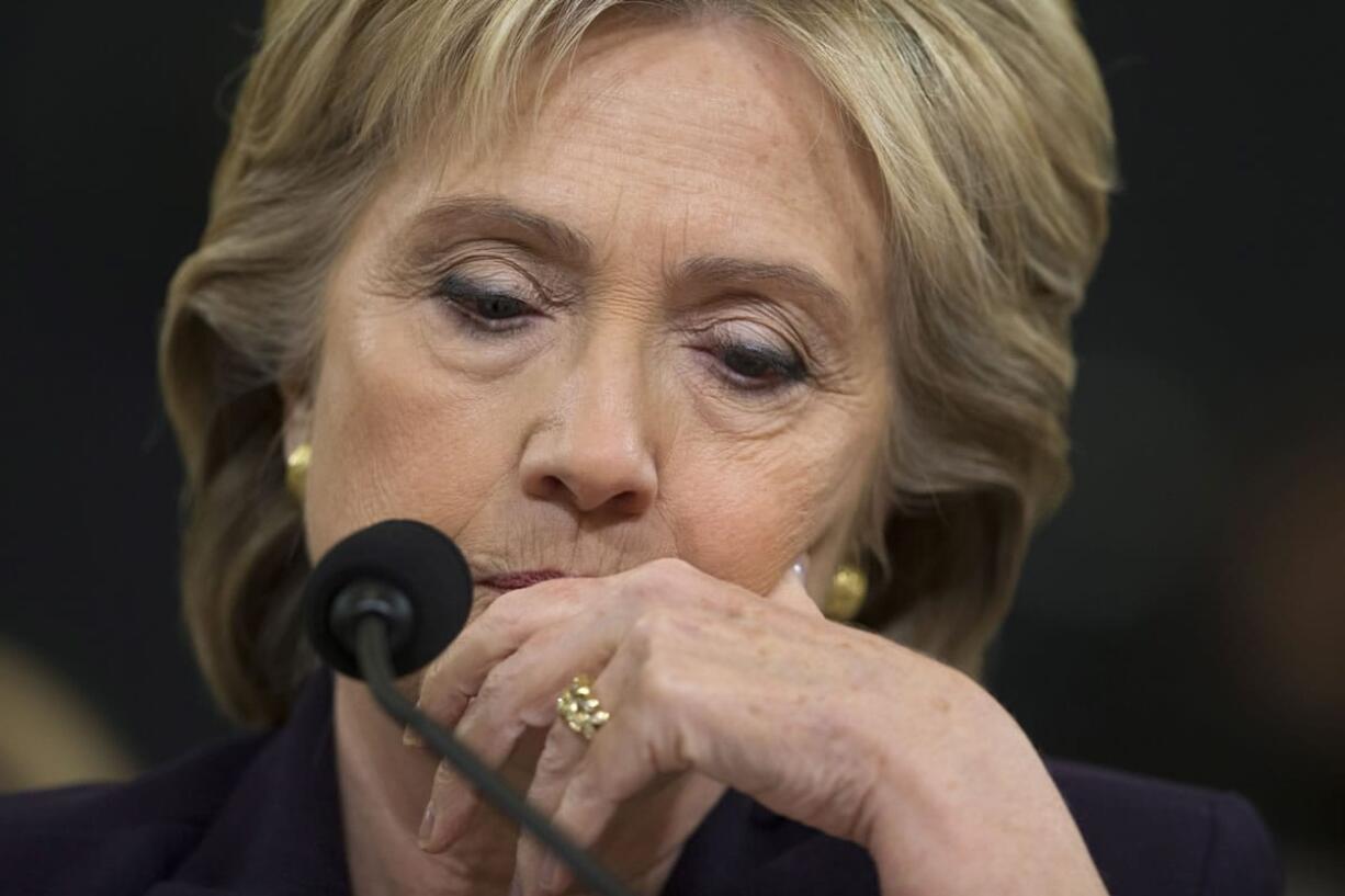 Democratic presidential candidate, former Secretary of State Hillary Rodham Clinton listens while testifying on Capitol Hill in Washington, Thursday, Oct. 22, 2015, before the House Benghazi Committee.