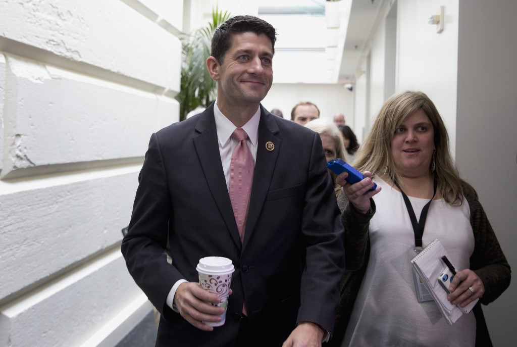 Rep. Paul Ryan, R-Wis. is pursued by reporters as he walks from a House GOP candidate forum on Capitol Hill in Washington on Wednesday. The House is poised to vote on a bipartisan pact charting a two-year budget truce and Republicans are set to nominate Ryan as the chamber&#039;s new speaker, milestones GOP leaders hope will transform their party&#039;s recent chaos into calm in time for next year&#039;s presidential and congressional campaigns.