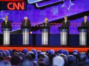 Democratic presidential candidates Jim Webb, from left, Sen. Bernie Sanders, Ind.-Vt., Hillary Rodham Clinton, Martin O&#039;Malley and Lincoln Chafee take the stage Tuesday in Las Vegas.