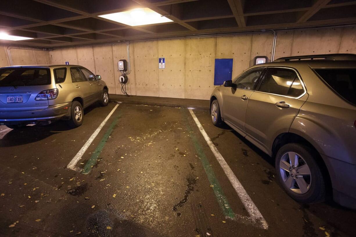 This electric vehicle charging station in a parking garage, unused Dec. 10, is among the 14 rarely used stations in downtown Eugene, Ore.