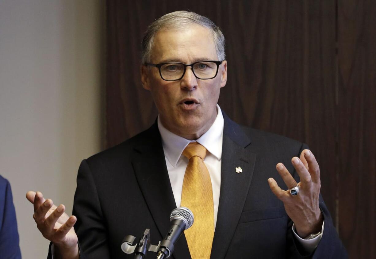 Washington Gov. Jay Inslee addresses a news conference Thursday in Seattle.