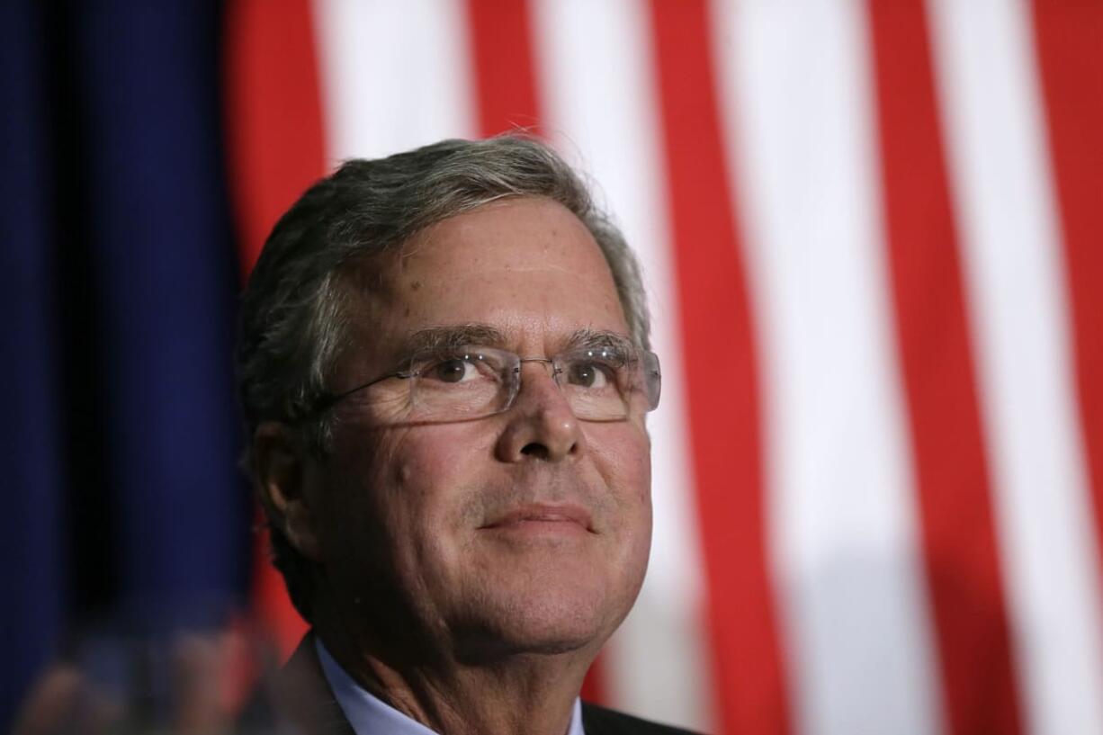 Republican presidential candidate Jeb Bush waits on stage in Davenport, Iowa.