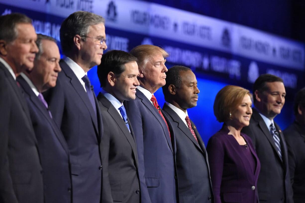 Republican presidential candidates, from left, John Kasich, Mike Huckabee, Jeb Bush, Marco Rubio, Donald Trump, Ben Carson, Carly Fiorina, and Ted Cruz take the stage during the CNBC debate Wednesday in Boulder, Colo. (MARK J.