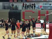 The Battle Ground volleyball team celebrates a point in its match against Camas on Thursday.