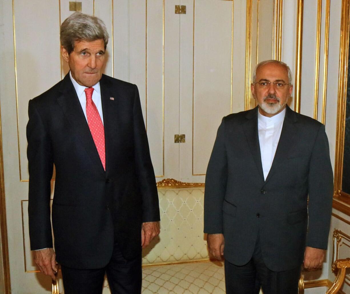 U.S. Secretary of State John Kerry and Iranian Foreign Minister Mohammad Javad Zarif, right, pose for a photograph in November before a bilateral meeting of the closed-door nuclear talks in Vienna, Austria. Diplomats say Iran and the U.S.