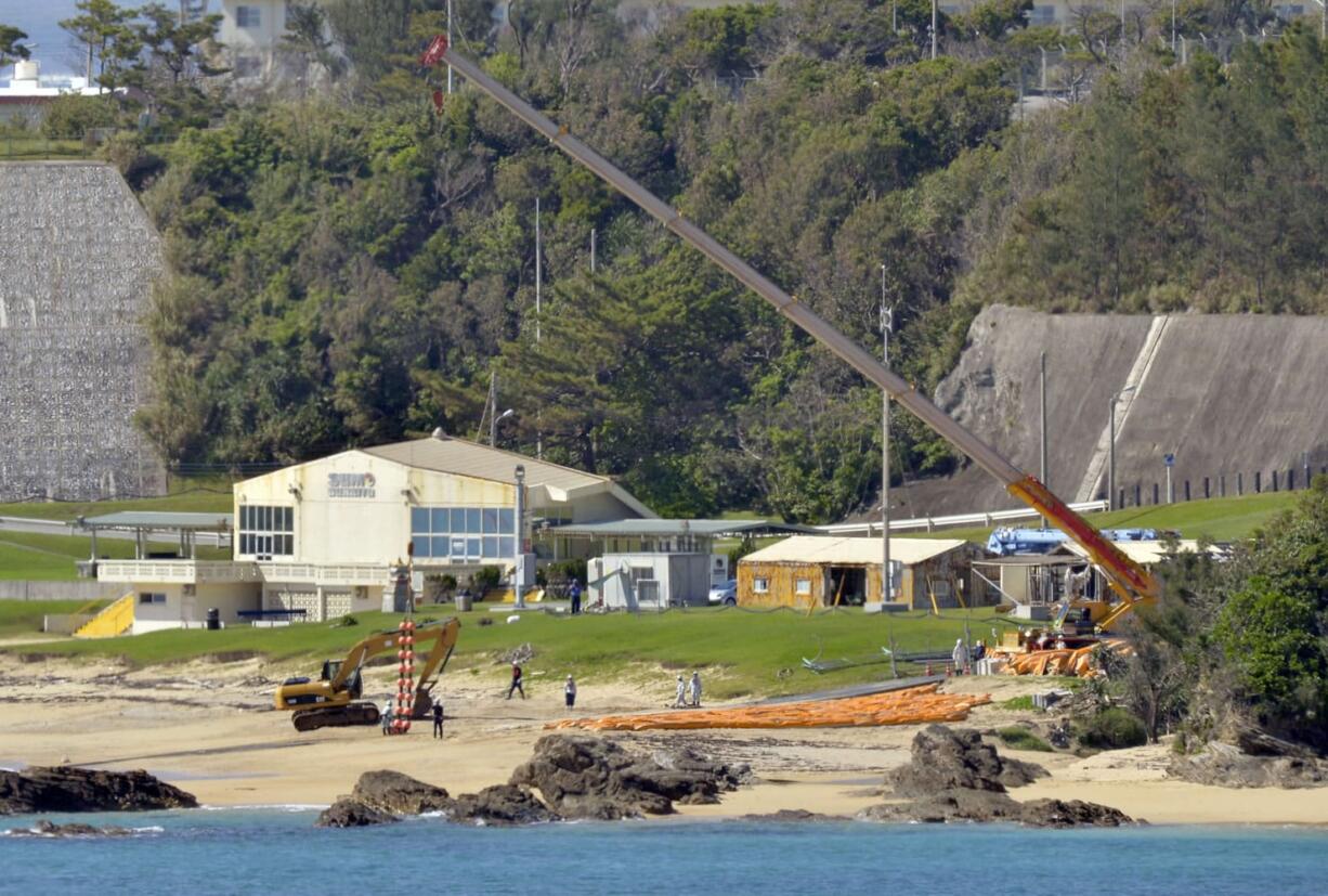 In this Sept. 13 file photo, a crew works on the construction of a U.S. military base at Henoko beach in Nago, Okinawa, southern Japan.