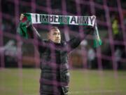 Portland Timbers head coach Caleb Porter celebrates with fans after defeating the Colorado Rapids on Sunday.