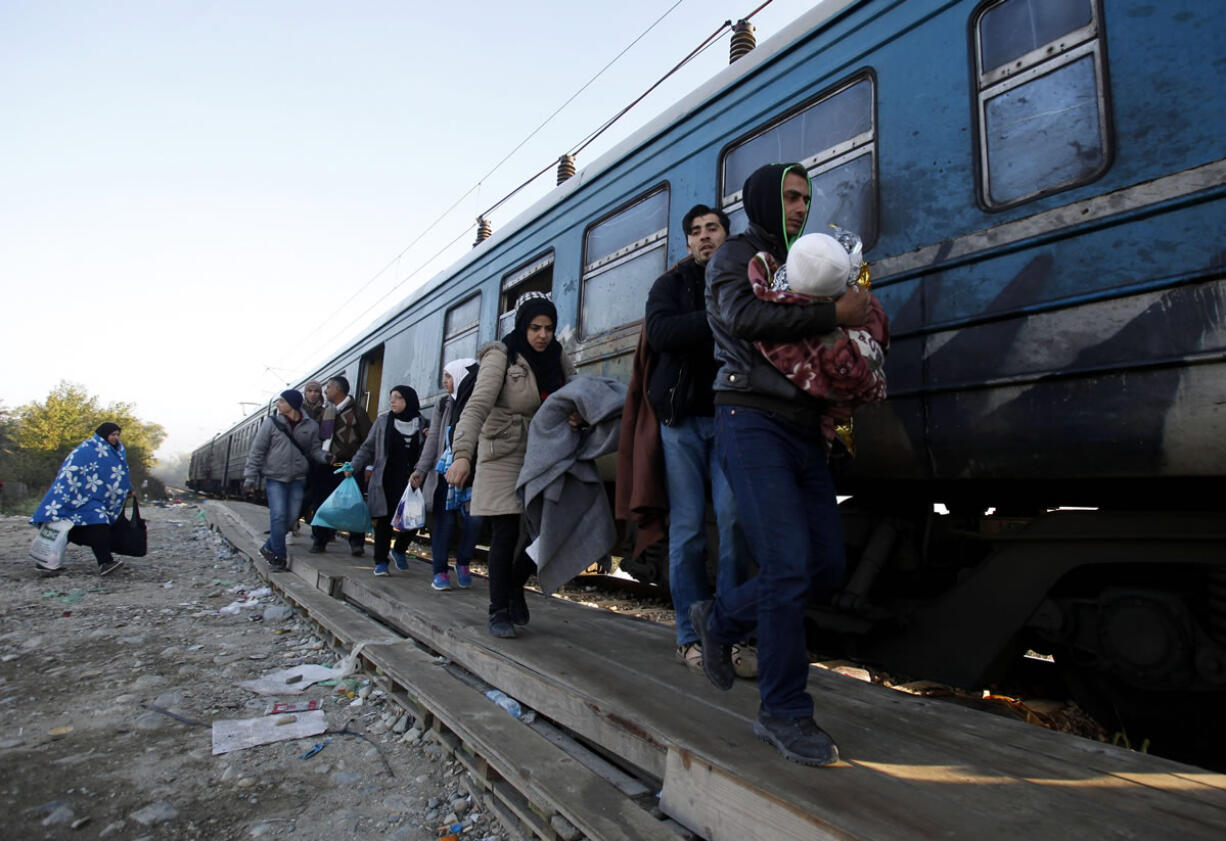 A group of migrants and refugees board a train Friday heading toward Serbia, at the transit center for refugees near the southern Macedonian town of Gevgelija, after crossing the border from Greece. The World Health Organization urged Thursday the health authorities in Europe to make sure to detect and treat the migrants&#039; cold-related diseases as winter approaches, emphasizing that refugees should be given heated shelters, warm meals and proper clothing but also influenza vaccines.