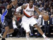 Portland Trail Blazers forward LaMarcus Aldridge, right, drives on Orlando Magic forward Channing Frye during the first half Saturday, Jan. 10, 2015.