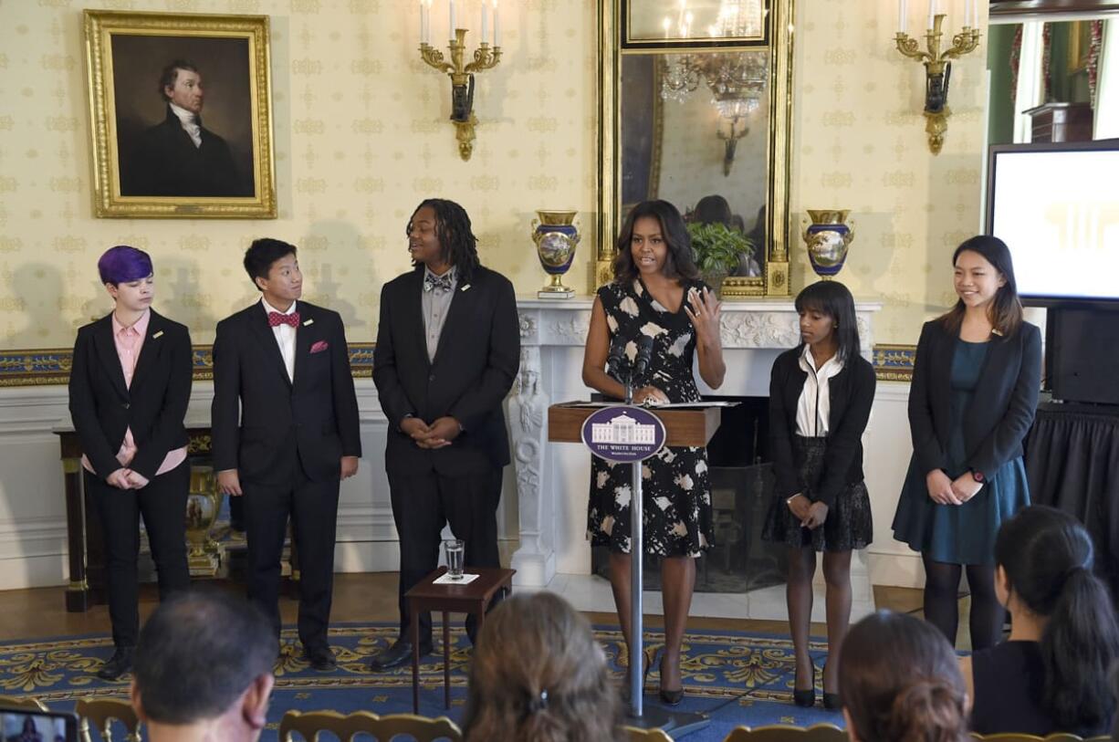 First lady Michelle Obama speaks in Blue Room of the White House in Washington, Thursday, Oct. 8, 2015, during an event to honor the 2015 class of the National Student Poets Program (NSPP), the nation?s highest honor for youth poets. From left are, Anna Lance, 17, of Anchorage, Alaska, David Xiang,17, of Little Rock, Ark., De&#039;John Hardges, 16, of Cleveland, Mrs. Obama, Chasity Hale, 16, of Miami, and Eileen Huang, 15, of Lincroft, N.J.