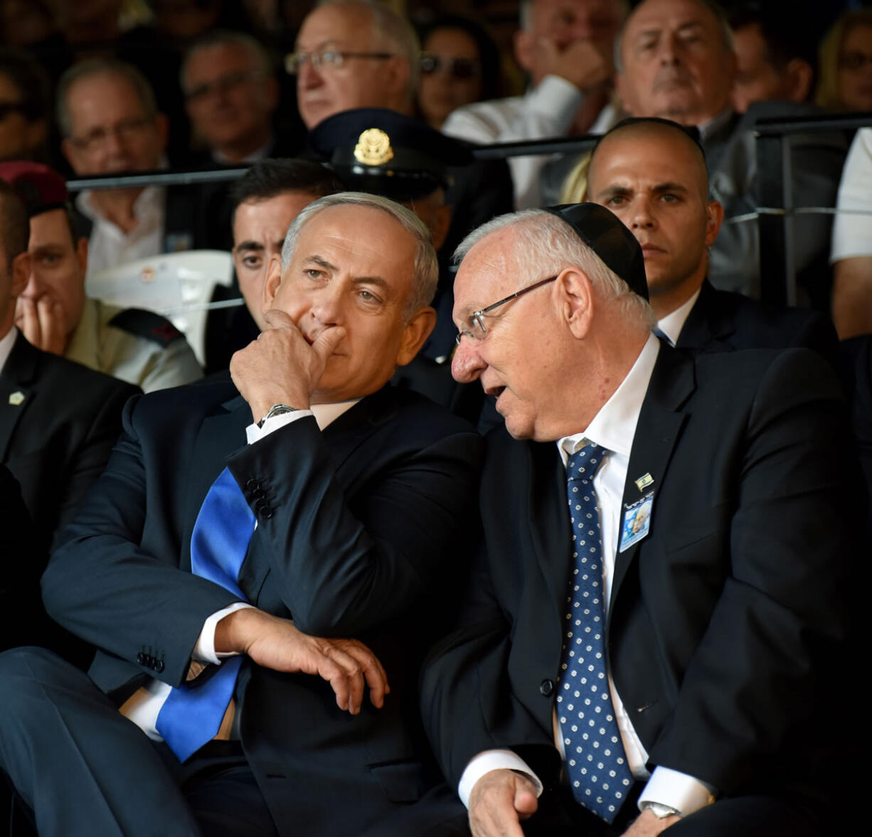 Israeli Prime Minister Benjamin Netanyahu, left, and President Reuven Rivlin speak during the official memorial ceremony marking the 20th anniversary of the assassination of the late Prime Minister Yitzhak Rabin in the Mt. Herzl Cemetery in Jerusalem, Israel, on Monday.