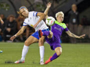 FC Kansas City midfielder Lauren Holiday, left, and Seattle Reign FC midfielder Jessica Fishlock collide during the first half of the NWSL soccer championship match in Portland, Ore., Thursday, Oct. 1, 2015.