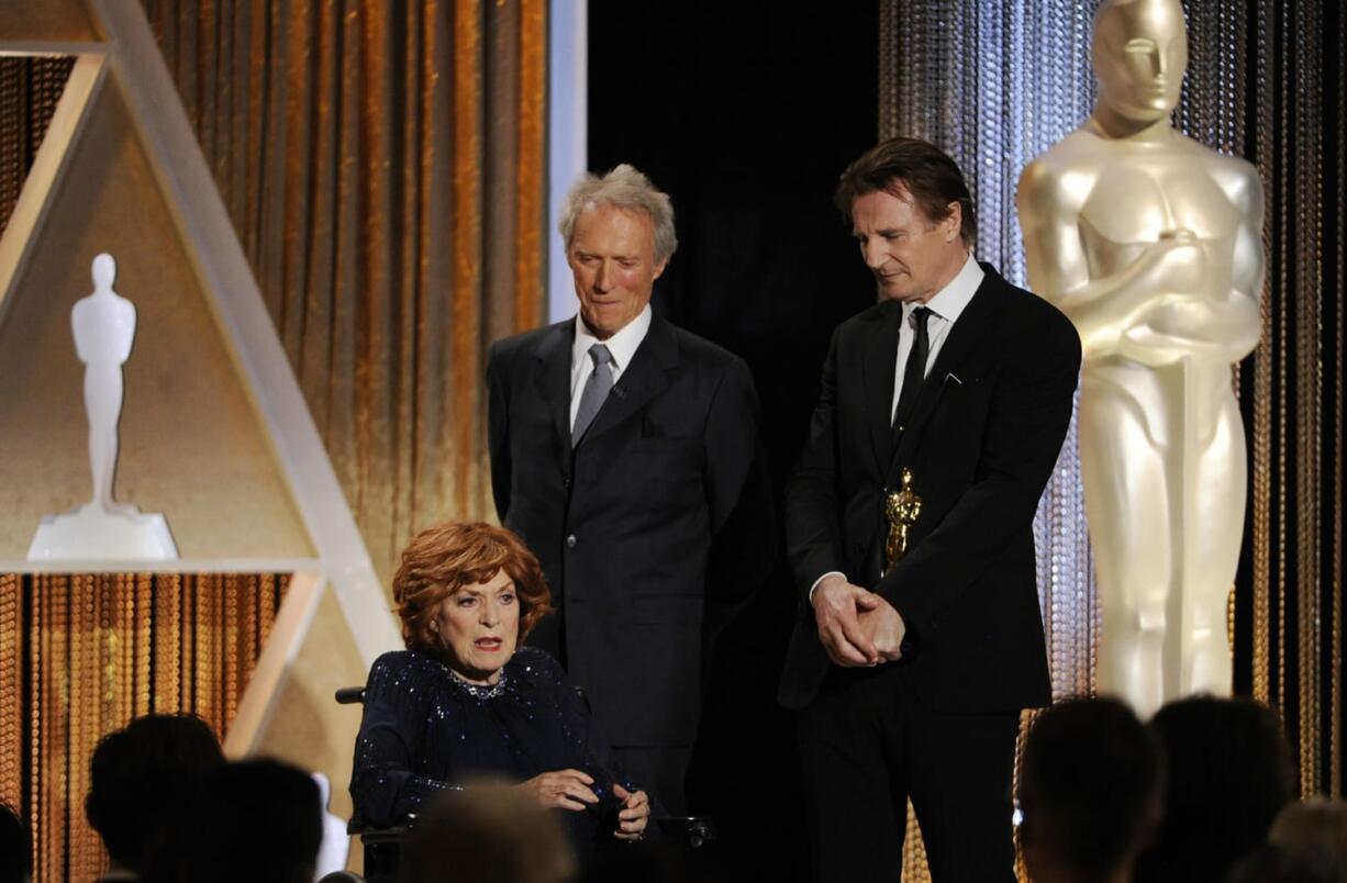 Actress Maureen O&#039;Hara, from left, accepts her Honorary Oscar onstage Nov. 8, 2014, from presenters Clint Eastwood and Liam Neeson during the 2014 Governors Awards in Los Angeles. O&#039;Hara died in her sleep Oct. 24 at her home in Boise, Idaho.