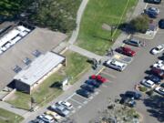 This Oct. 1 photo shows an aerial view of Umpqua Community College, in Roseburg, Ore., where a deadly shooting occurred. Chris Mintz, an Oregon college student celebrated as a hero for running toward danger while a gunman opened fire at Umpqua Community College, said Friday in a statement posted on Facebook that the shooter showed no emotion as he shot Mintz mulitple times.