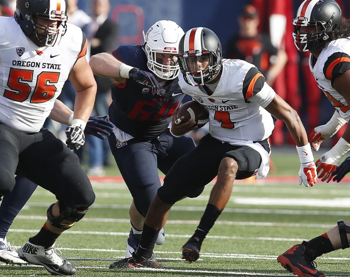 Oregon State quarterback Seth Collins (4) runs the football against Arizona during the second half Saturday, Oct. 10, 2015, in Tucson, Ariz.