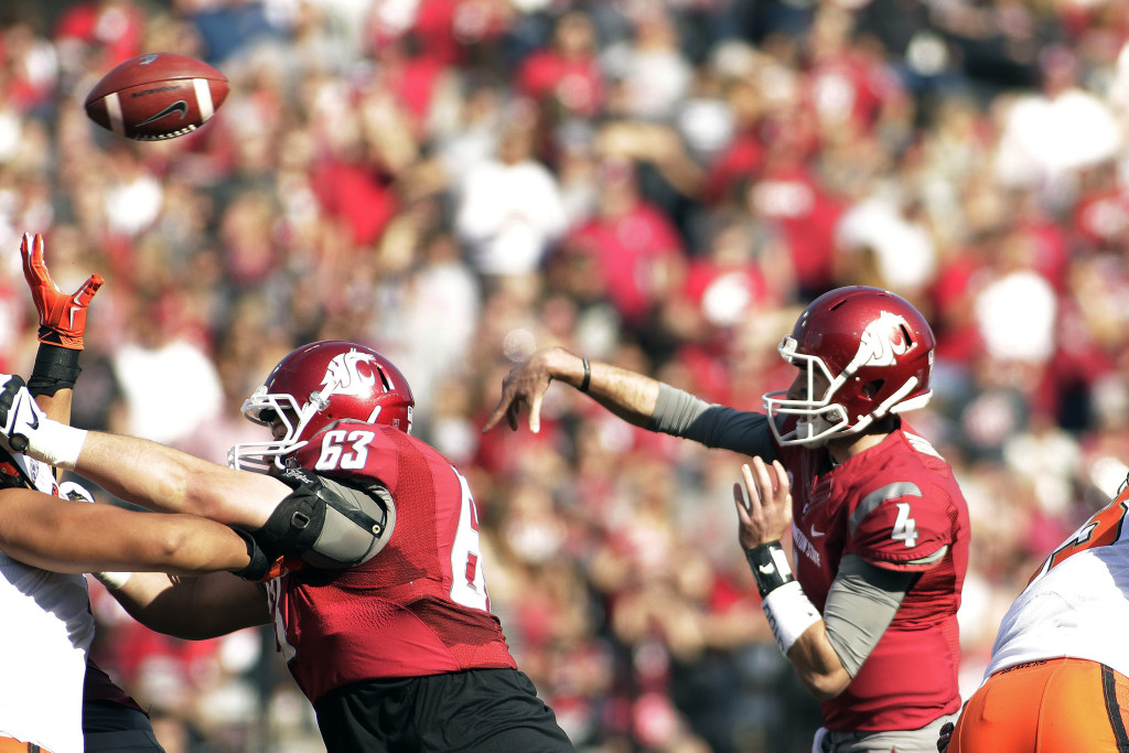 Washington State quarterback Luke Falk (4) throws a pass during the first half of an NCAA college football game against Oregon State, Saturday, Oct. 17, 2015, in Pullman, Wash.