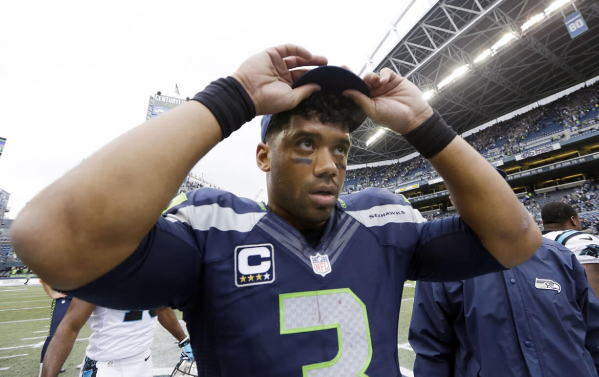 Seattle Seahawks quarterback Russell Wilson leaves the field after the Carolina Panthers defeated his team 27-23 Sunday n Seattle.