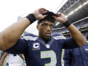 Seattle Seahawks quarterback Russell Wilson leaves the field after the Carolina Panthers defeated his team 27-23 Sunday n Seattle.