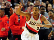 Portland Trail Blazers guard C.J. McCollum (3) celebrates after hitting a three-point shot during the first quarter of an NBA basketball game against the New Orleans Pelicans in Portland, Ore., Wednesday, Oct. 28, 2015.