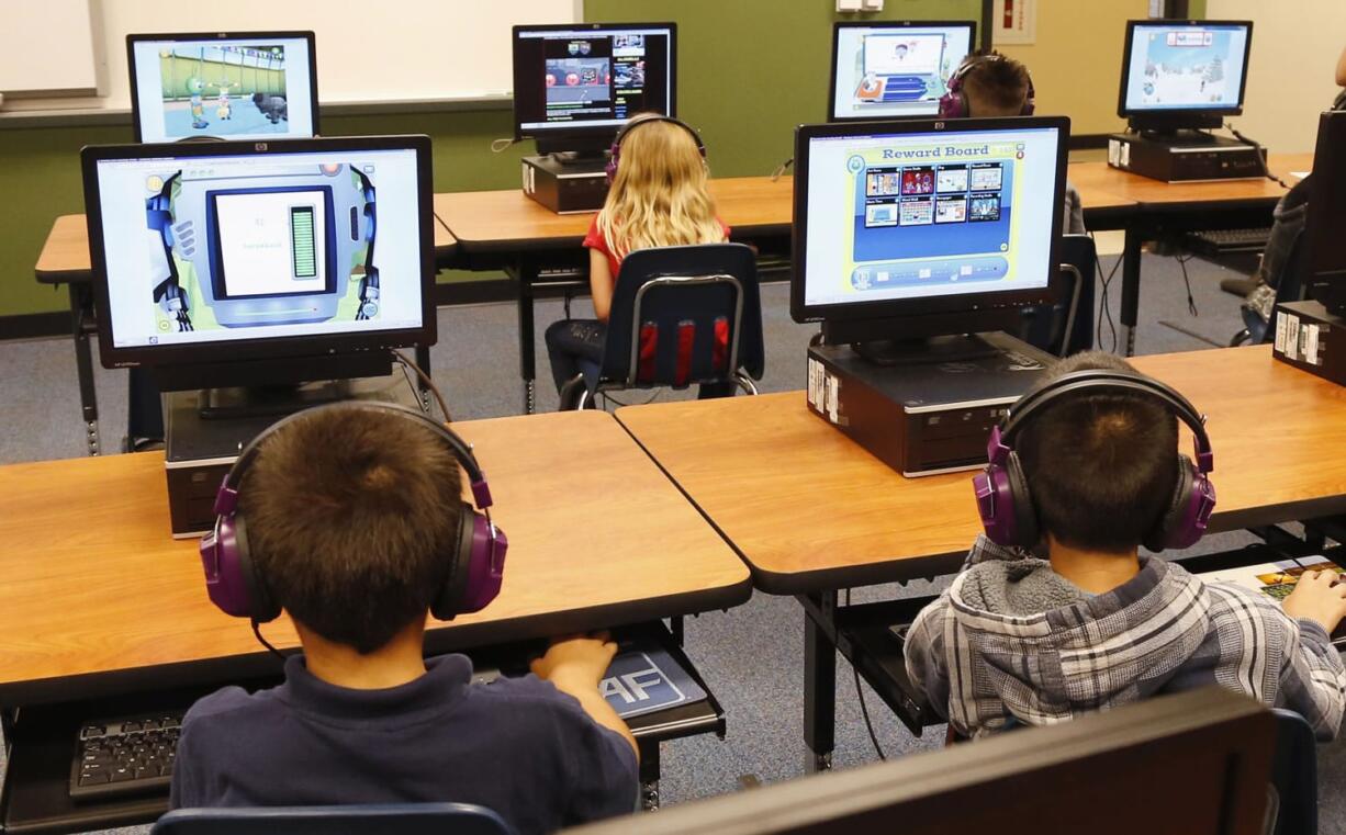 Students at a summer reading academy at Buchanan elementary school work in the computer lab at the school in Oklahoma City.